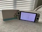 Nintendo Switch Oled Model HEG-001 Handheld Console 64GB White. Fixed Price $214.00.