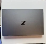 (48356-2) Hp AX201D2W Laptop Z (with Charger Included). Fixed Price $1000.00.